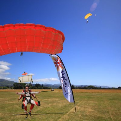 a person flying a kite in a field
