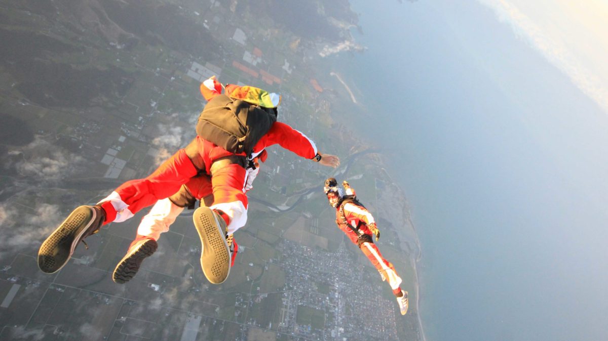 a man flying through the air while riding skis