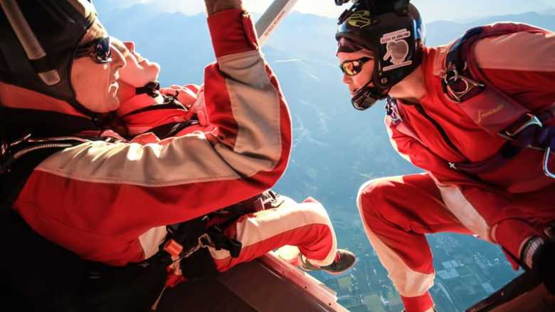 a group of people riding skis on a snowy surface
