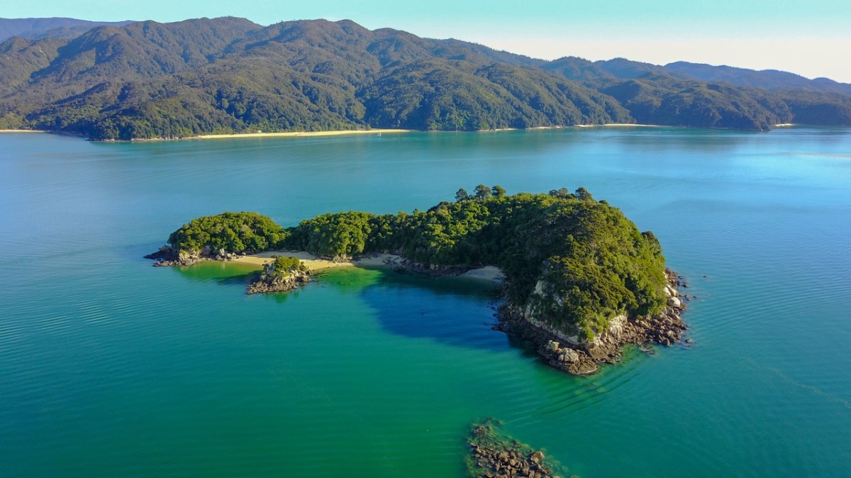 a body of water with a mountain in the background