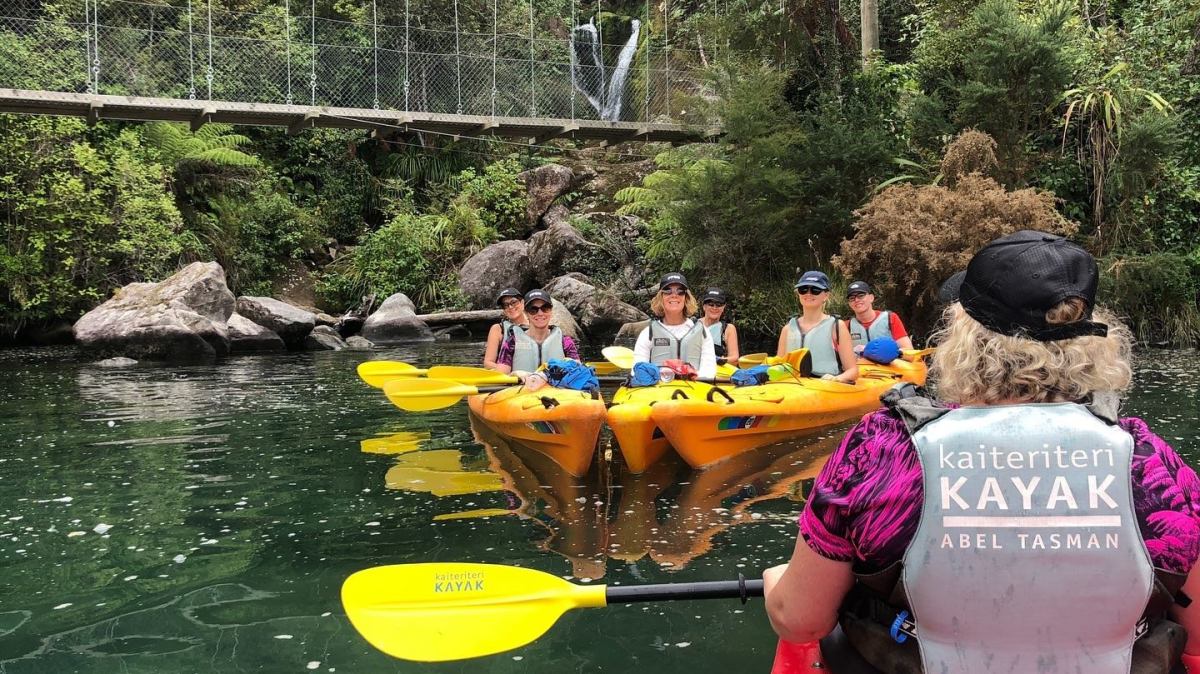 a group of people on a boat in the water