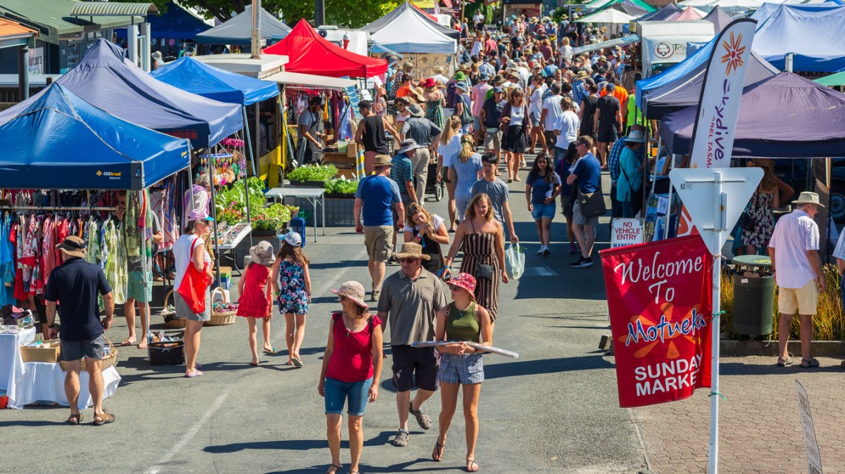 a group of people walking down the street