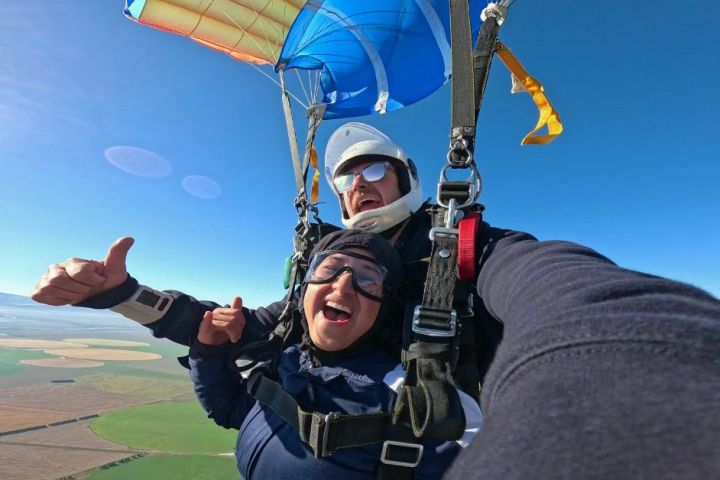 a person wearing a hat and sunglasses