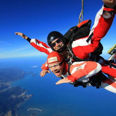 a man flying through the air while riding a motorcycle