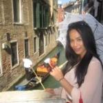 a woman standing in front of a building