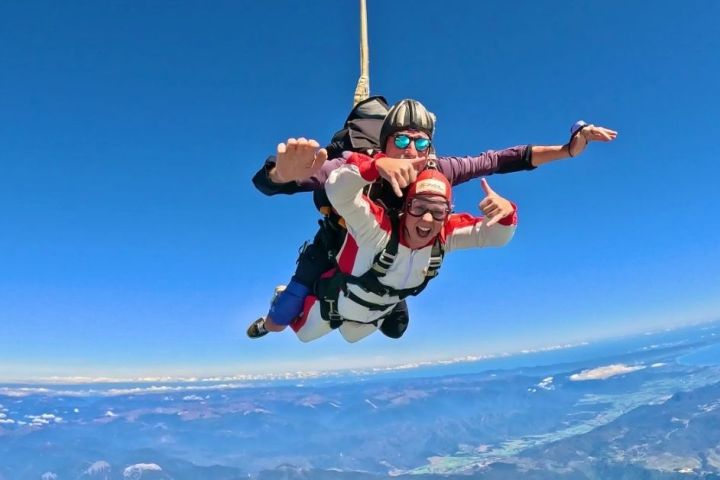 a man flying through the air while riding skis