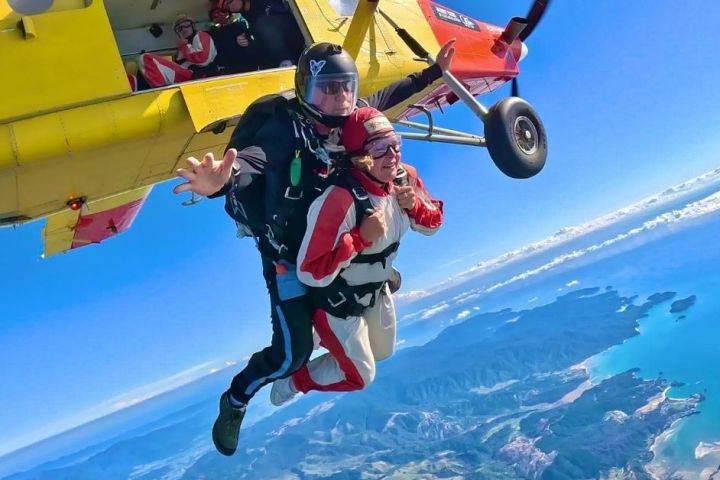 a man flying through the air while riding skis