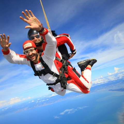 A man with arms held high during his Skydive