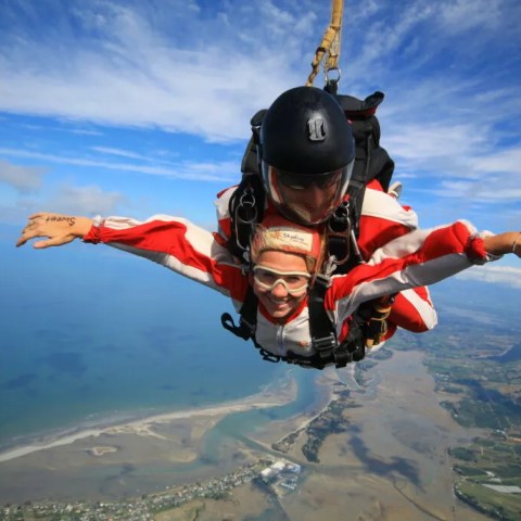 Open arms tandem skydiving in Abel Tasman