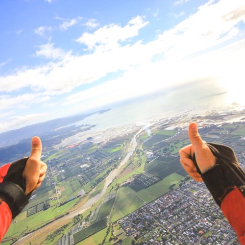 Thumbs up during a skydive in Abel Tasman.