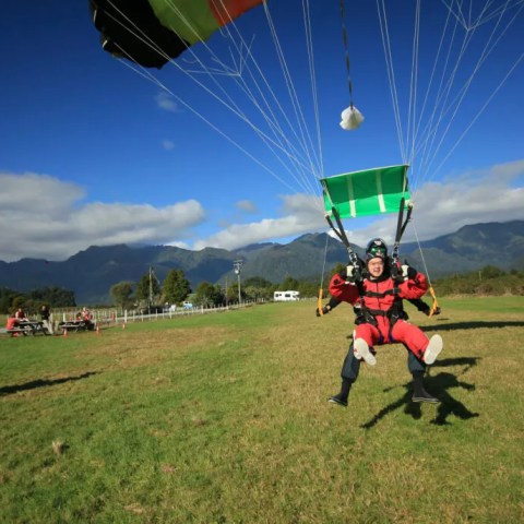 Tandem Skydivers on the canopy almost landing in Franz Josef