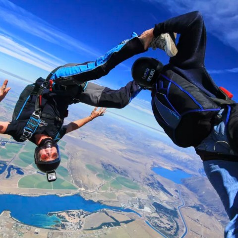 Sports skydiving mid-air in Mt. Cook