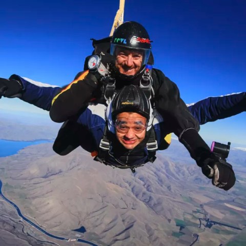 Tandem skydive mid-air during a jump in Mt. Cook