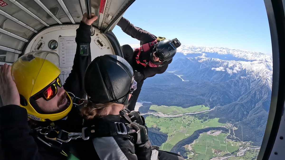 a person with a helmet on top of a mountain