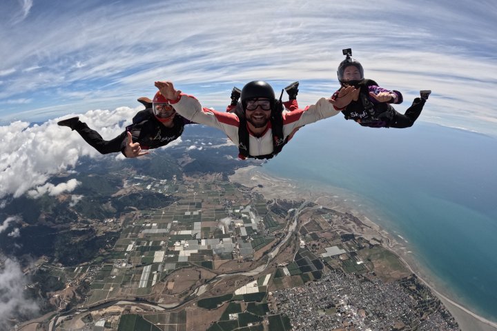 a man riding a surfboard on top of a mountain
