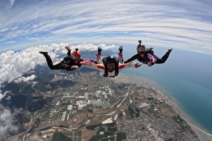 a group of people riding on top of a mountain