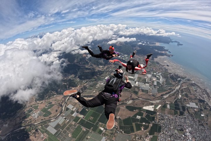a man riding a wave on top of a mountain