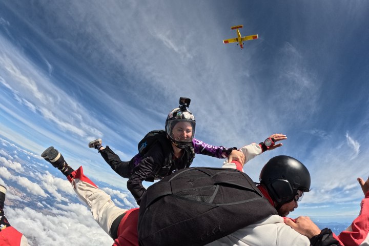 a group of people riding skis on top of a snow covered slope