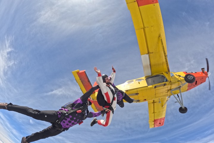 a man flying through the air while riding skis