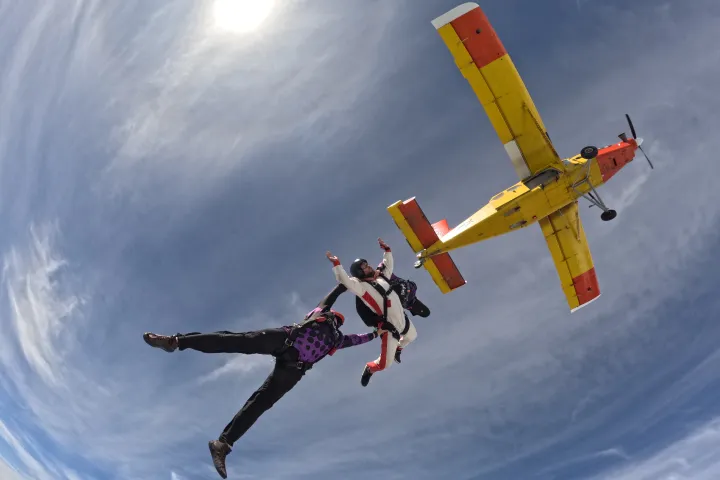 a person flying through the air while riding skis