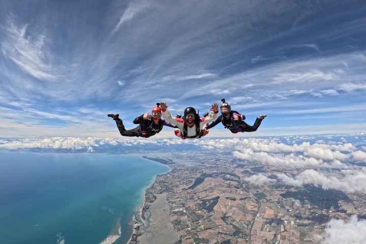 a man flying through the air while riding skis
